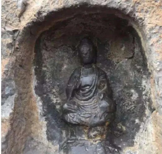 洛阳龙门石窟佛像被游客摸出包浆,这具体是咋回事?